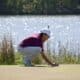 Ada senior Michael Huff sizes up his putt during action at the 2021 Ardmore Invitational Monday at the Dornick Hills Golf Course in Ardmore.