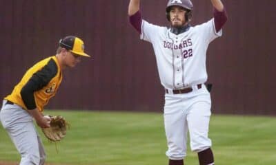 Richard R. Barron - The Ada News -- Ada senior Zac Carroll (22) stands on base after hitting a double during a matchup with Tecumseh Thursday night at Cougar Field.