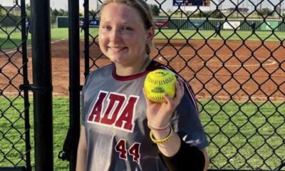 Ada freshman Bradi Odom shows off the ball after she cranked a two-run homer in the Lady Cougars’ district matchup with Classen SAS Monday evening.