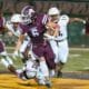Richard R. Barron | The Ada News -- Ada running back Kaden Gallagher (6) finds some running room as Ardmore defender CJ Williams (25) dives at his feet during their Week 1 matchup Friday night at Norris Field. Gallagher finished with seven rusher for 19 yards in the contest.