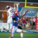Richard R. Barron | The Ada News -- Ada senior receiver Trey Ivy (8) leaps high over Durant defender Frank Monroy (7) to come down with a huge 46-yard catch that set up the first of three Ada first-quarter touchdowns.