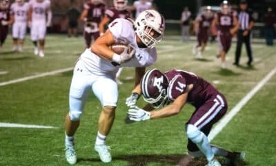 Richard R. Barron | The Ada News - Ada’s Andrew Hughes (14) prepares to tackle Gunner Kerr of Tuttle during their District 4A-2 matchup Friday night at Norris Field. The Cougars travel to Cushing in Week 9.