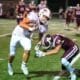 Richard R. Barron | The Ada News - Ada’s Andrew Hughes (14) prepares to tackle Gunner Kerr of Tuttle during their District 4A-2 matchup Friday night at Norris Field. The Cougars travel to Cushing in Week 9.
