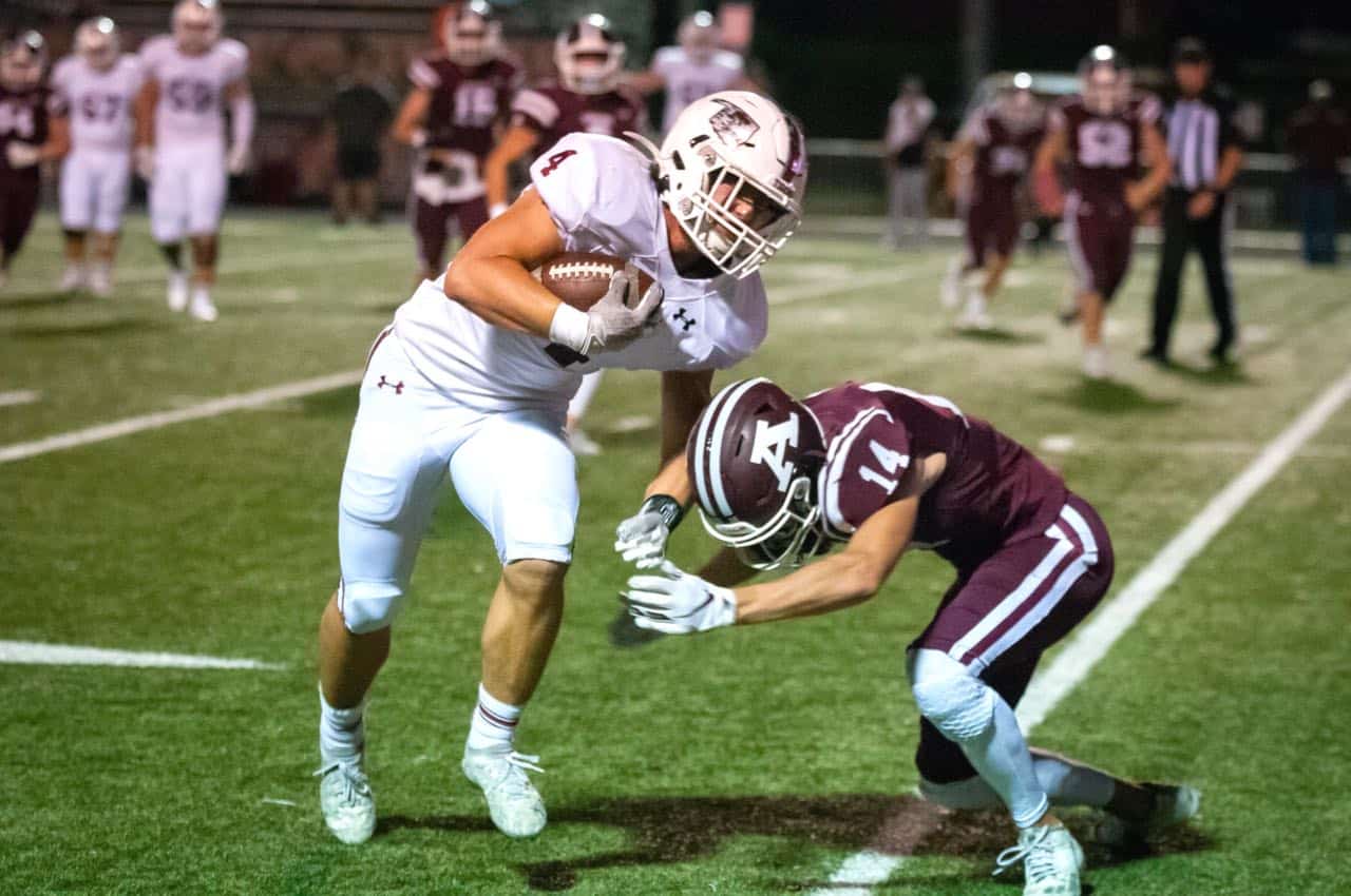 Richard R. Barron | The Ada News - Ada’s Andrew Hughes (14) prepares to tackle Gunner Kerr of Tuttle during their District 4A-2 matchup Friday night at Norris Field. The Cougars travel to Cushing in Week 9.