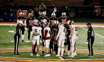 Kristi Mitchell | For The Ada News -- Ada senior team captains Jonah Ascencion (5), Hunter Condon (47), Trey Ivy (8) and Brogen Cochran (16) shake hands with Cushing’s team captains during the pregame coin flip before their District 4A-2 matchup Friday at O’Dell Field. Ada hosts Classen SAS on Senior Night at Norris Field Friday in the Cougars’ final game of the 2021 season.