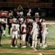 Kristi Mitchell | For The Ada News -- Ada senior team captains Jonah Ascencion (5), Hunter Condon (47), Trey Ivy (8) and Brogen Cochran (16) shake hands with Cushing’s team captains during the pregame coin flip before their District 4A-2 matchup Friday at O’Dell Field. Ada hosts Classen SAS on Senior Night at Norris Field Friday in the Cougars’ final game of the 2021 season.