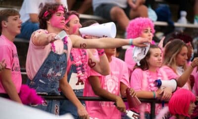 Richard R. Barron | The Ada News -- Ada High School student Wyatt Brown is shown with his arms outstretched as he and his fellow students attend the Ada Cougars "Pink Out Night" home football game against Blanchard Oct. 1.