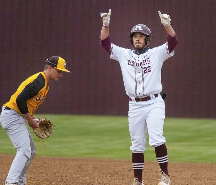 Richard R. Barron - The Ada News -- Ada senior Zac Carroll (22) stands on base after hitting a double during a matchup with Tecumseh Thursday night at Cougar Field.