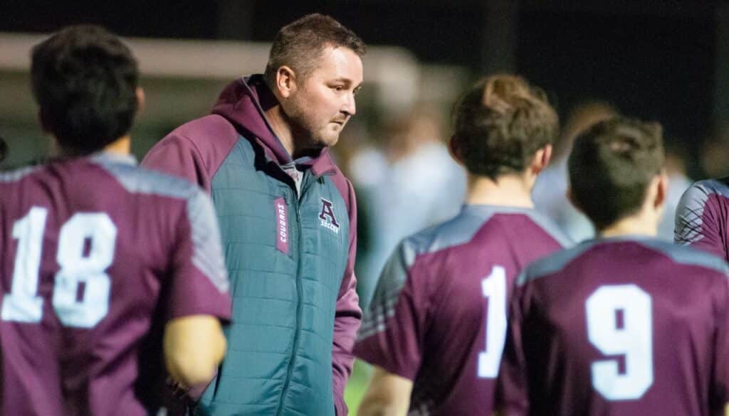 Richard R. Barron | The Ada News Ada head coach Cole Jones talks with his players during action earlier this season.