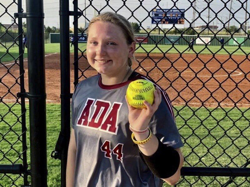 Ada freshman Bradi Odom shows off the ball after she cranked a two-run homer in the Lady Cougars’ district matchup with Classen SAS Monday evening.