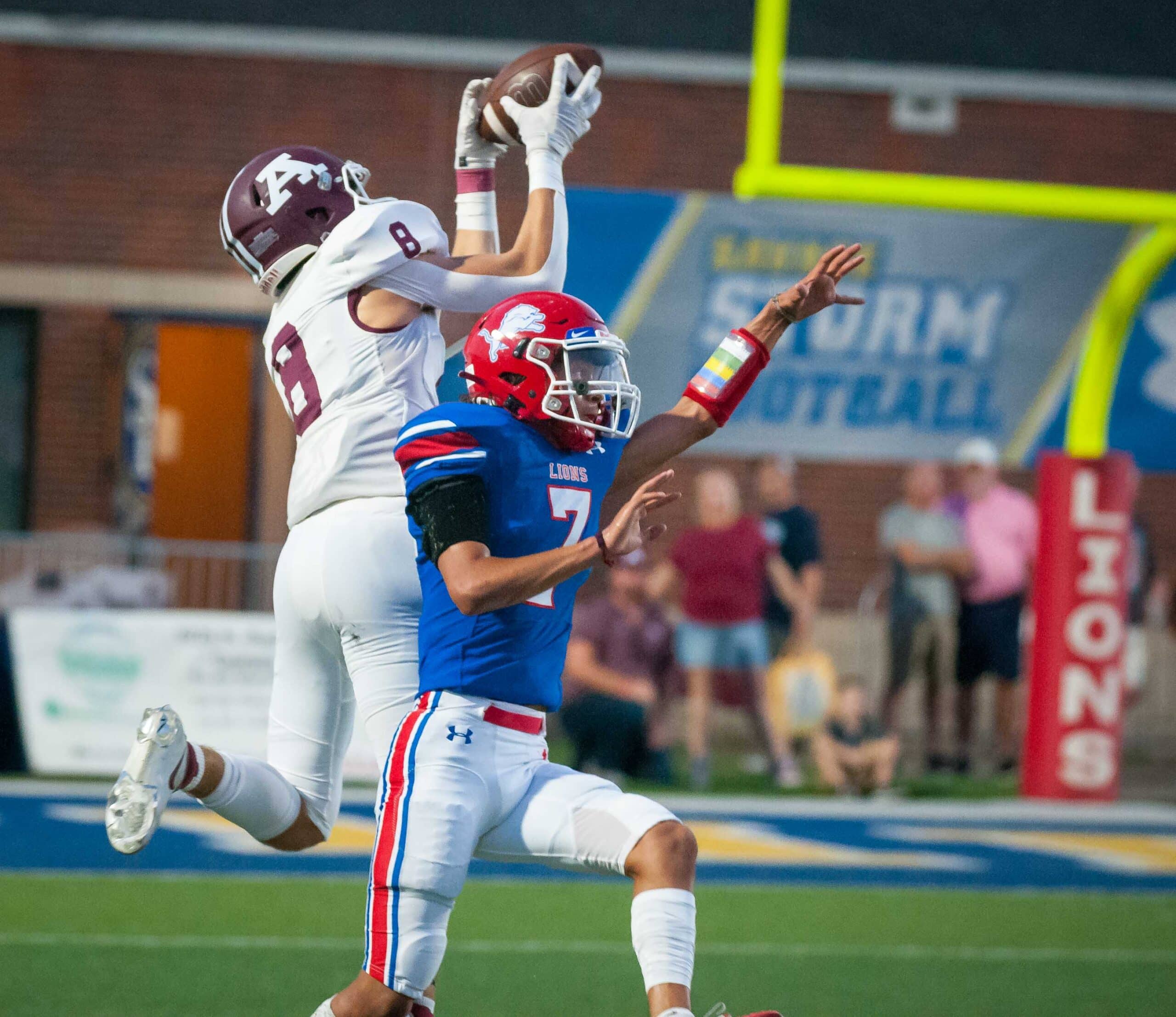 Richard R. Barron | The Ada News -- Ada senior receiver Trey Ivy (8) leaps high over Durant defender Frank Monroy (7) to come down with a huge 46-yard catch that set up the first of three Ada first-quarter touchdowns.