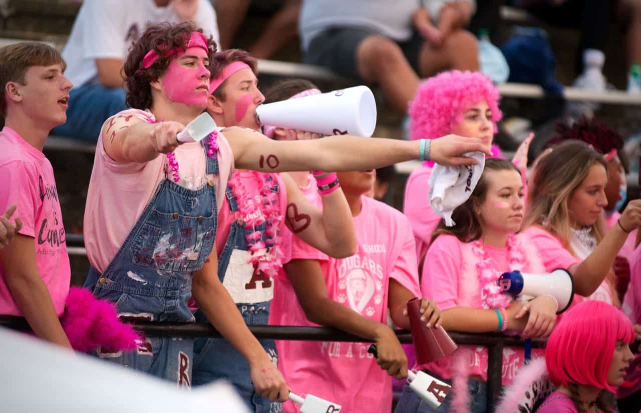 Richard R. Barron | The Ada News -- Ada High School student Wyatt Brown is shown with his arms outstretched as he and his fellow students attend the Ada Cougars "Pink Out Night" home football game against Blanchard Oct. 1.