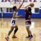 Carizma Nelson | For The Ada News -- Ada junior Cooper Patterson keeps the ball away from the opposition during a Monday afternoon contest with host Durant. The Cougars won 62-52.